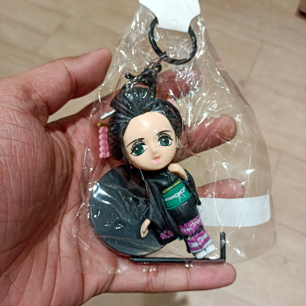 Anime-style keychain figure with display stand